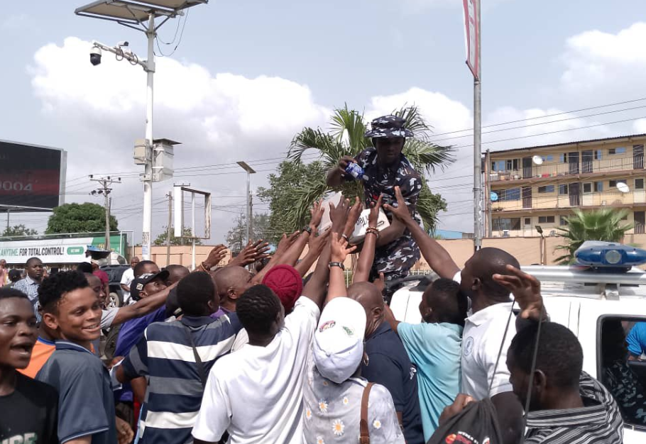 Police distribute biscuits, water to NLC protesters in Lagos